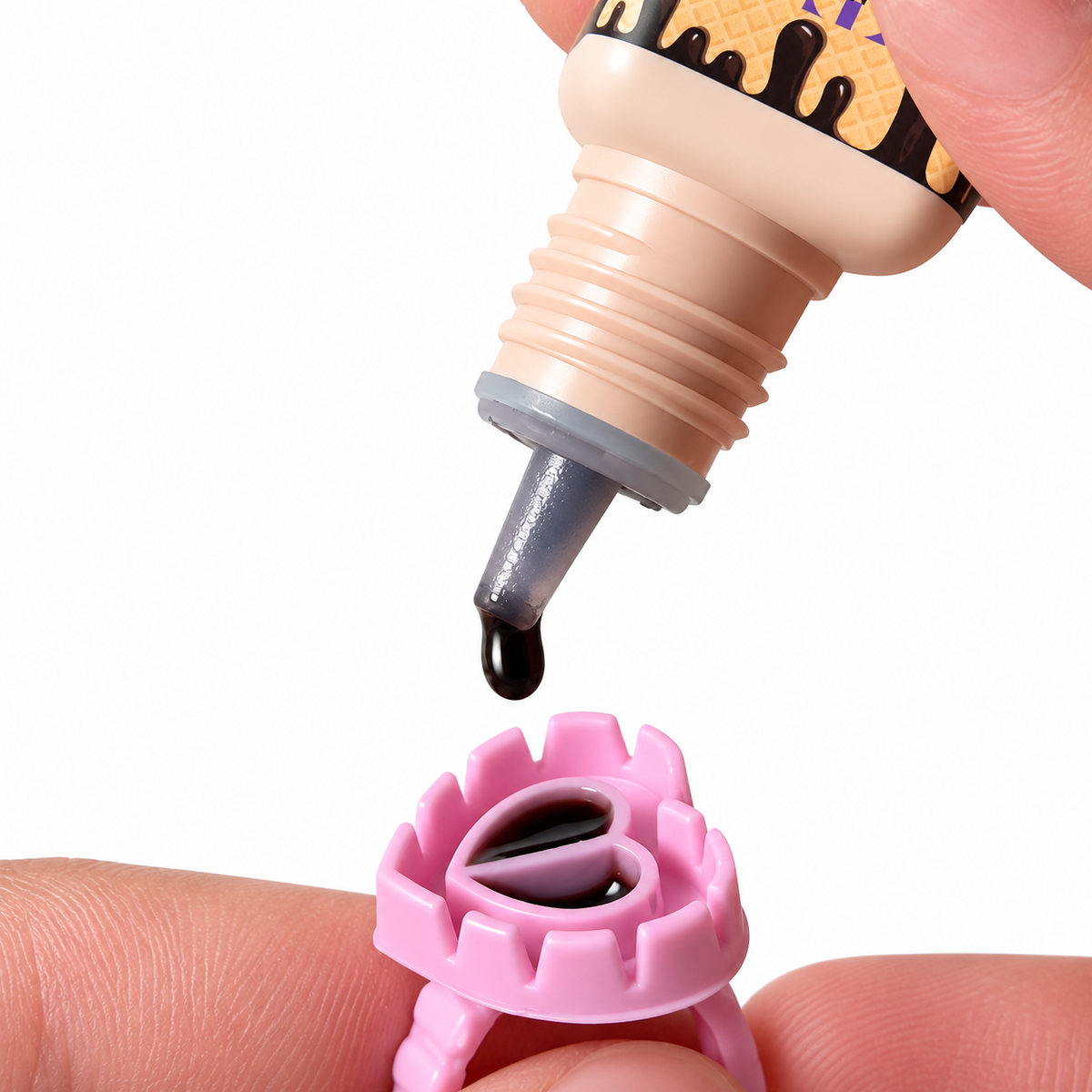 Application image with glue drop
Lash artist dispensing Chocolate Charm Bond brown eyelash extension adhesive onto lash glue ring for lash application