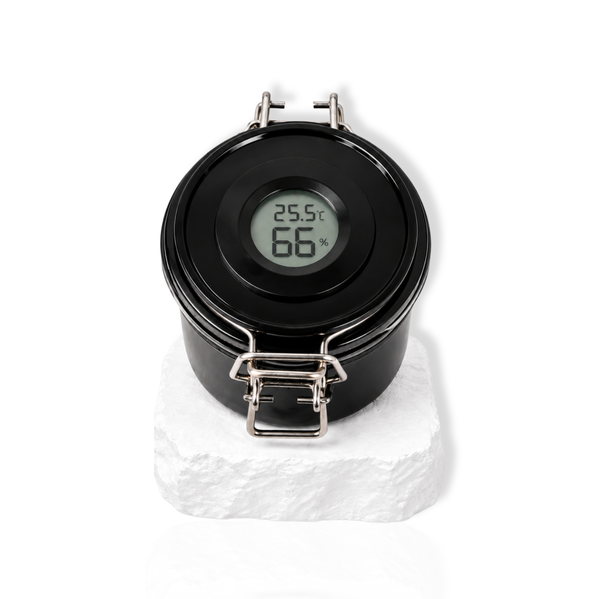 Black lash glue storage container with digital humidity display on the lid displayed on a white stone surface.