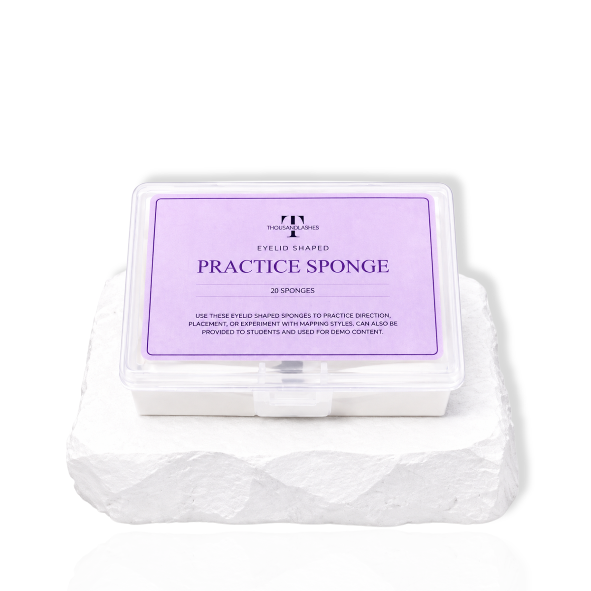 Eyelid shaped practice sponge set in a clear container for lash extension training and mapping practice.