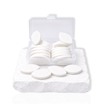Eyelid shaped practice sponges in a clear storage box for eyelash extension training and lash mapping practice.