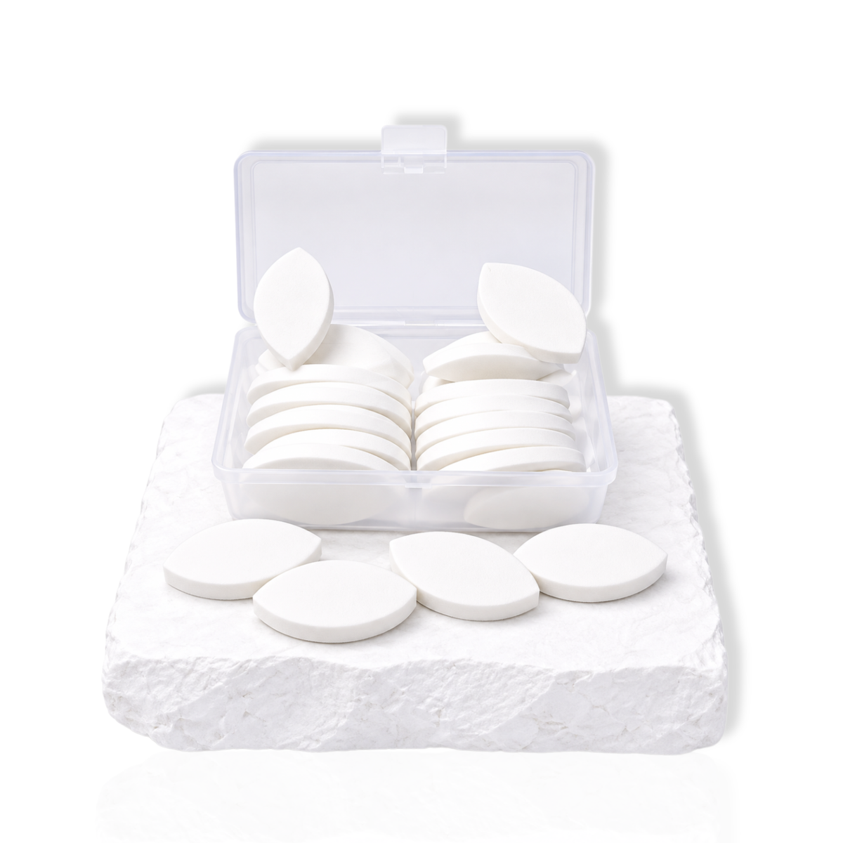 Eyelid shaped practice sponges in a clear storage box for eyelash extension training and lash mapping practice.
