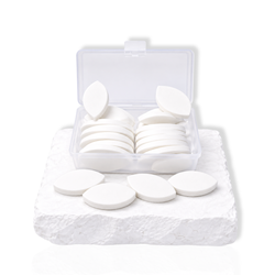 Eyelid shaped practice sponges in a clear storage box for eyelash extension training and lash mapping practice.