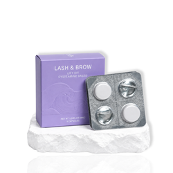Lash and Brow Lift Kit cysteamine based with a purple box and five lash lift capsules displayed on a white surface.