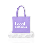 Local Lash Plug lash artist tote bag in purple with bold white logo design, spacious carry bag for lash tools and studio essentials