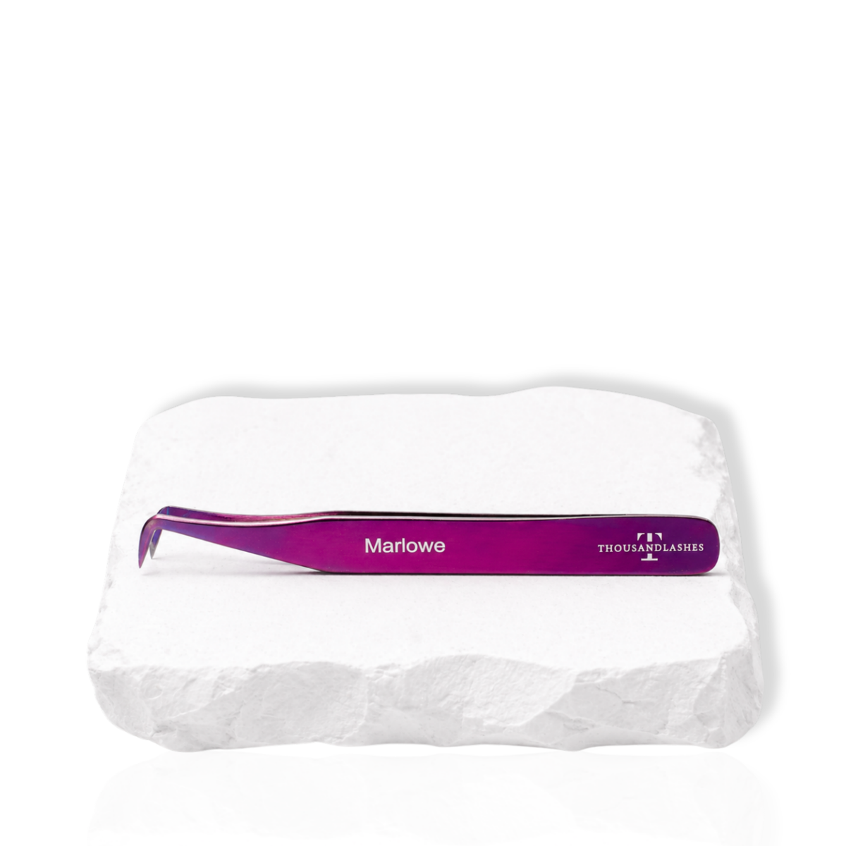 Marlowe purple angled lash tweezer displayed on a white stone surface
