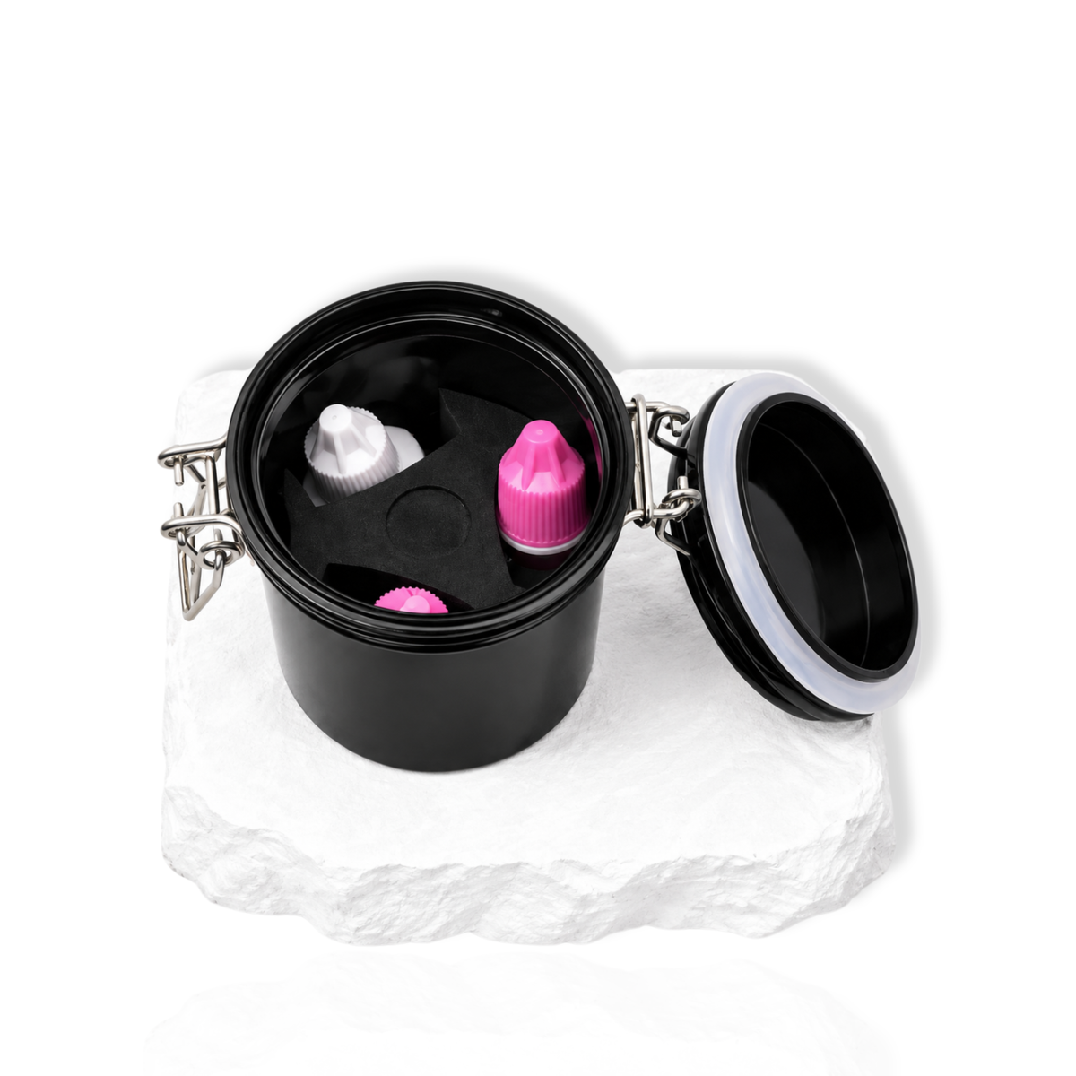Open black lash glue storage container showing lash adhesive bottles and accessories inside.