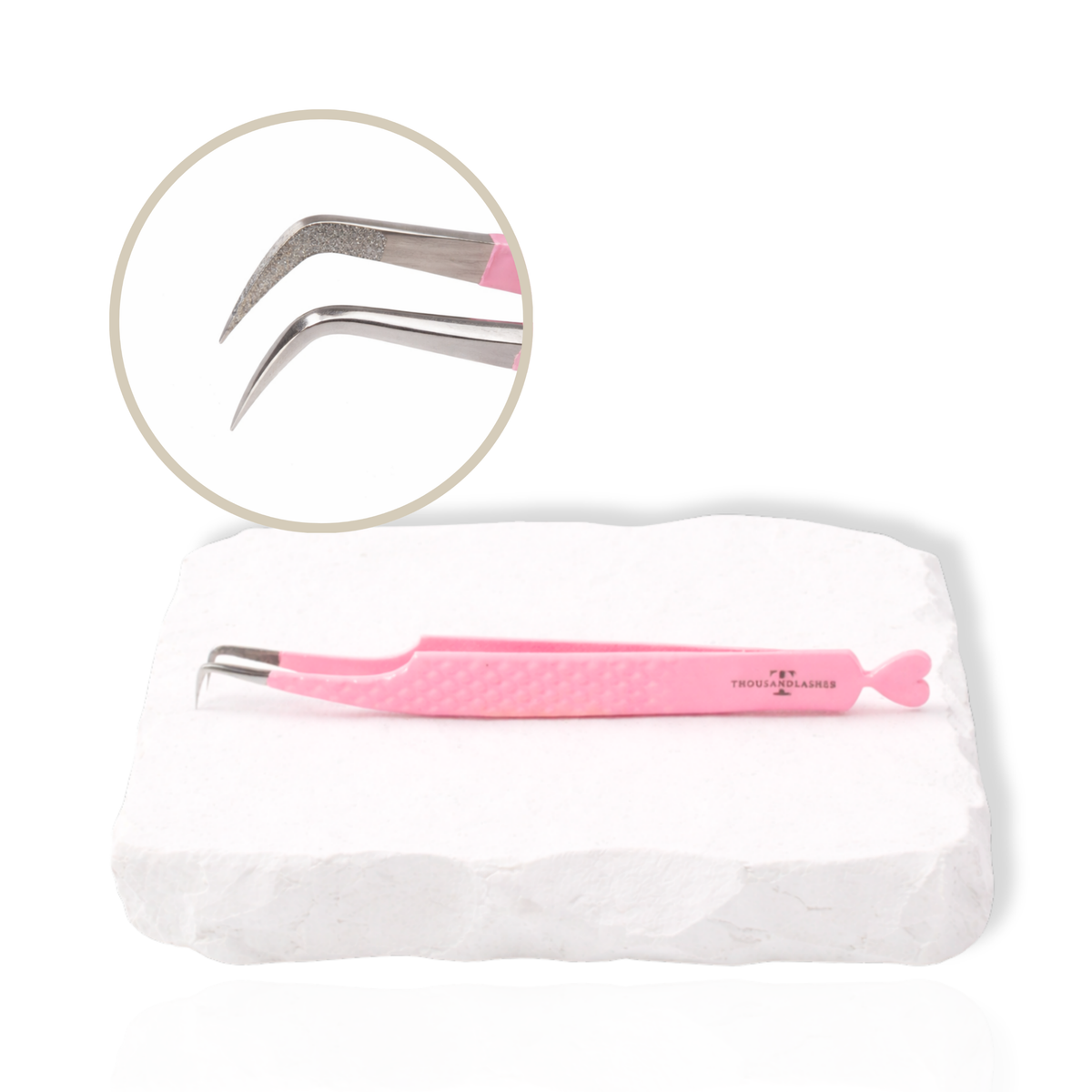 Pink Thousandlashes 90-degree lash tweezer with close-up view of the angled tip on a white stone surface.