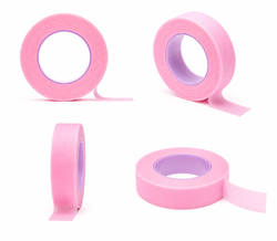 Pink micropore lash tape roll displayed as a tool for securing lower lashes and creating better access during lash work