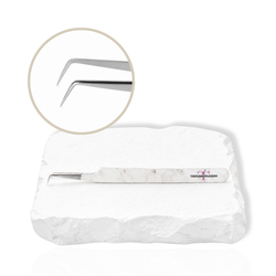 Precision Volume 90 Degree Tweezer with angled tip displayed on a white stone surface