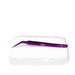 Purple Laila curved tip lash tweezer with angled pointed tip and Thousand Lashes branding displayed on a white background.