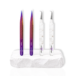 Purple and marble design eyelash extension tweezers displayed on a white platform for precision lash application.
