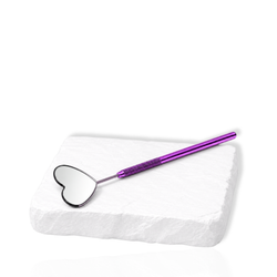 Purple eyelash extension mirror with a heart-shaped reflective head displayed on a white stone surface.