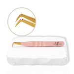 Rose gold boot-shaped lash tweezer with angled gold tip for eyelash extension application.