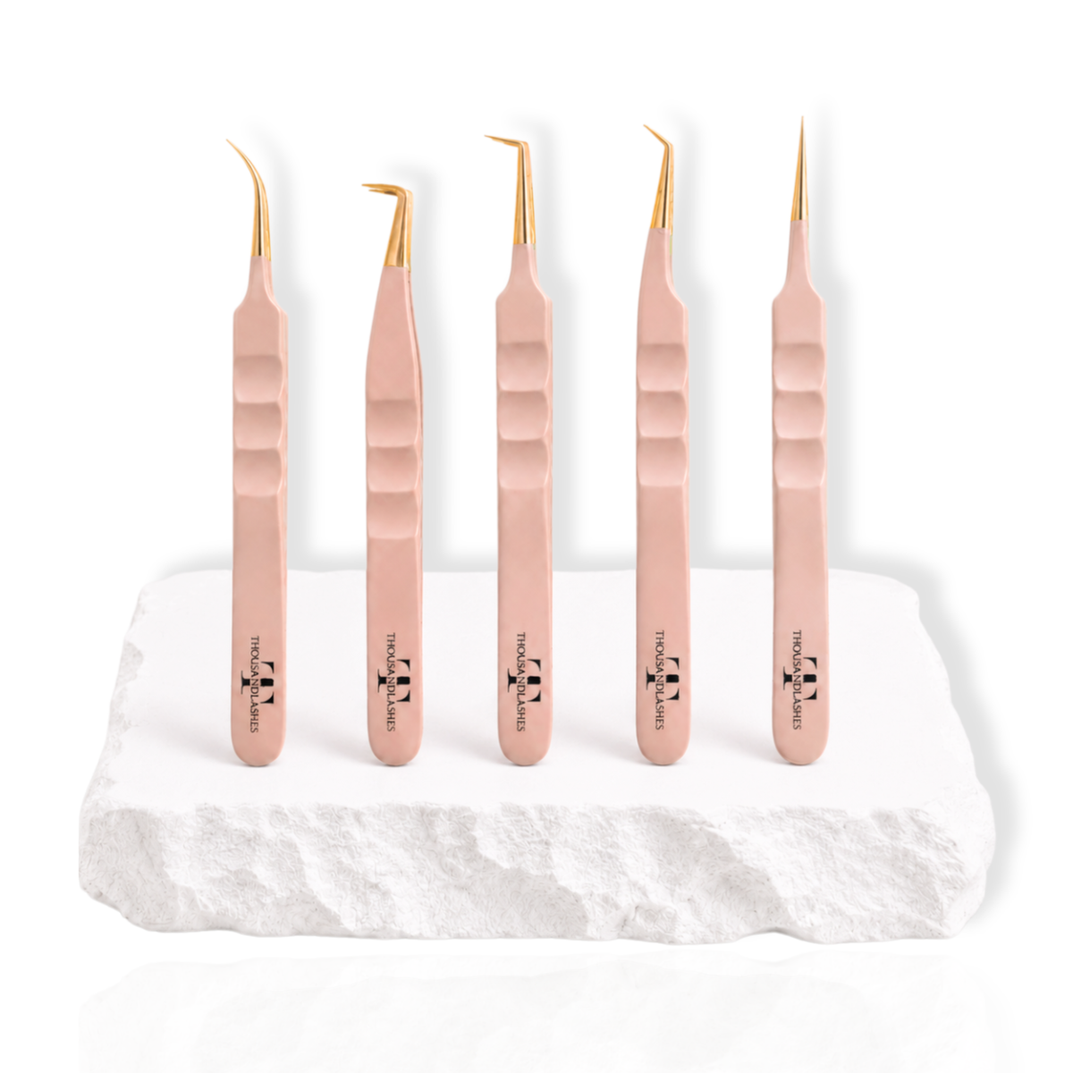 Set of five rose gold lash tweezers with different tips displayed upright on a white background for eyelash extension applications.