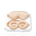 Silk lash mask with eye-shaped padding and adjustable strap displayed on a white background.