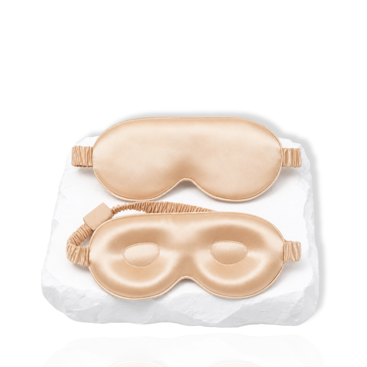 Silk lash mask with eye-shaped padding and adjustable strap displayed on a white background.