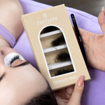 ThousandLashes Promade Fans lash box held beside a client during lash application
