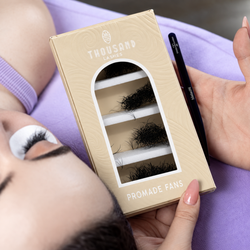 ThousandLashes Promade Fans lash box held beside a client during lash application