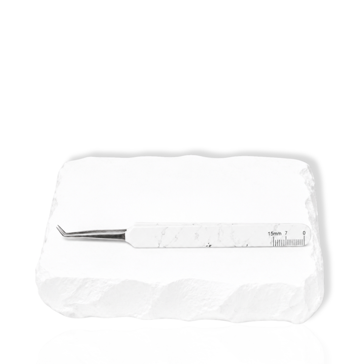Thousandlashes Baby Isolation 45-degree tweezer shown from the reverse side on a white stone surface.