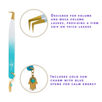 Thousandlashes Evil Eye angled lash tweezer showing the gold tip and Hamsa charm.