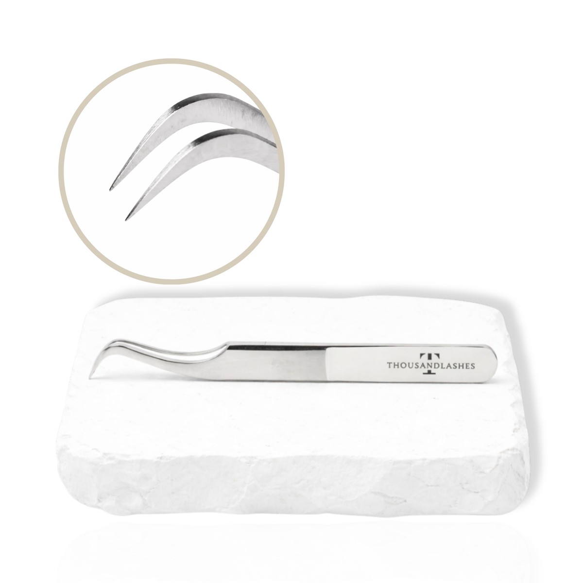 Thousandlashes M Narrow silver lash tweezer with close-up view of the curved tips.