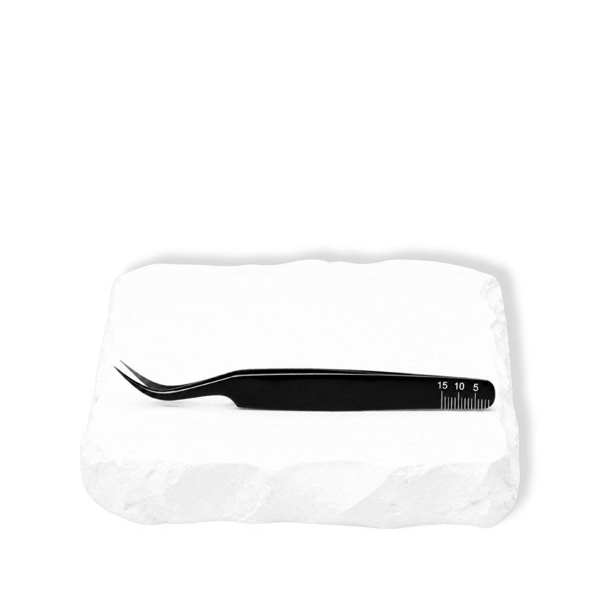 Thousandlashes Noir Collection curved tweezer shown from the reverse side on a white stone surface.
