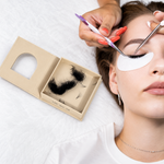 Thousandlashes Pro-Made Fans box beside a client during lash extension application