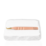 Thousandlashes nude 45-degree isolation tweezer shown from the reverse side on a white stone surface.