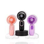 Three portable lash fans in pink, black, and purple with rhinestone details displayed on white stone stands.