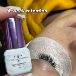 Ultra Crystal Bond adhesive bottle with lash retention result
ThousandLashes Ultra Crystal Bond Lash Adhesive shown with eyelash extensions after 4-week retention for Classic Hybrid and Volume lash sets
