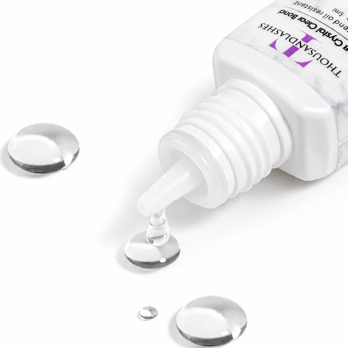 Ultra Crystal Clear Bond clear lash extension adhesive drop showing transparent formula for colored lash extensions