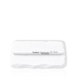White lash mapping pen displayed on a white stone surface.