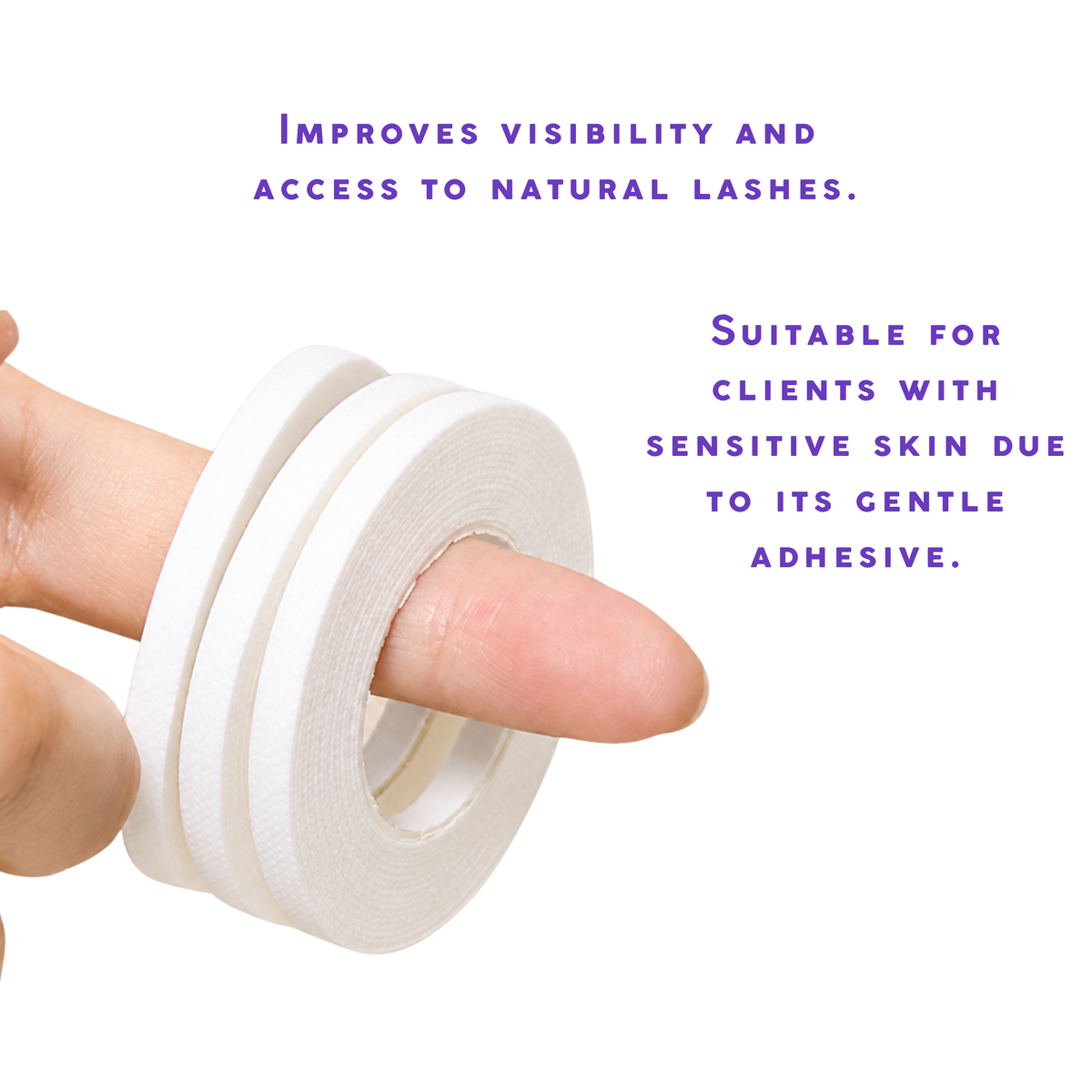 White lash tape roll held by hand showing narrow adhesive tape for eyelash extension under-eye support