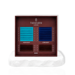 The Iris Edit color lash tray featuring lagoon and sapphire inspired blue lash spikes with brown and dark base lashes for custom lash designs.