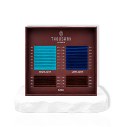 The Iris Edit color lash tray featuring lagoon and sapphire inspired blue lash spikes with brown and dark base lashes for custom lash designs.