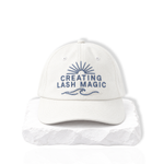 thousandlashes Lash Artist Cap with “Creating Lash Magic” embroidery, shown from the front.
