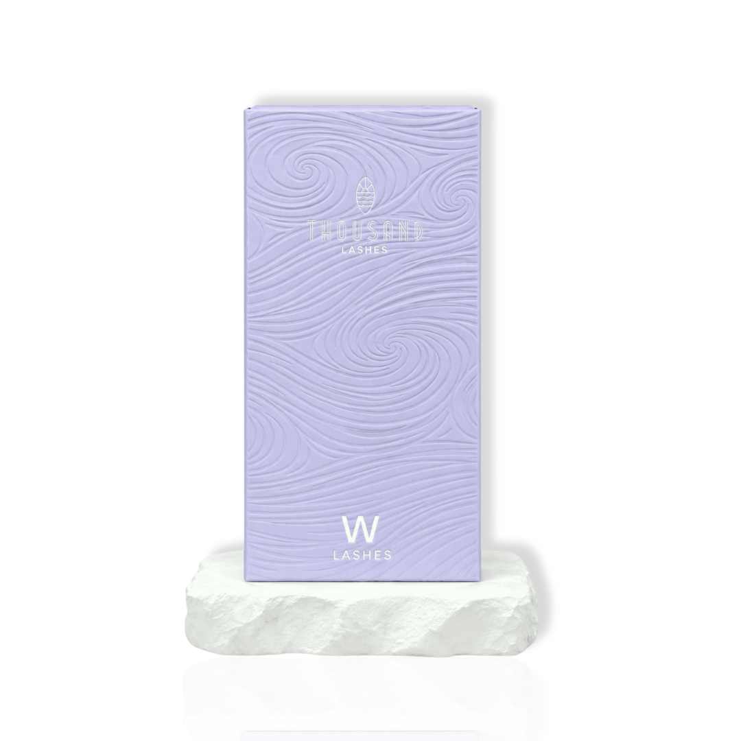 thousandlashes W Lashes tray box displayed on a white stone surface
